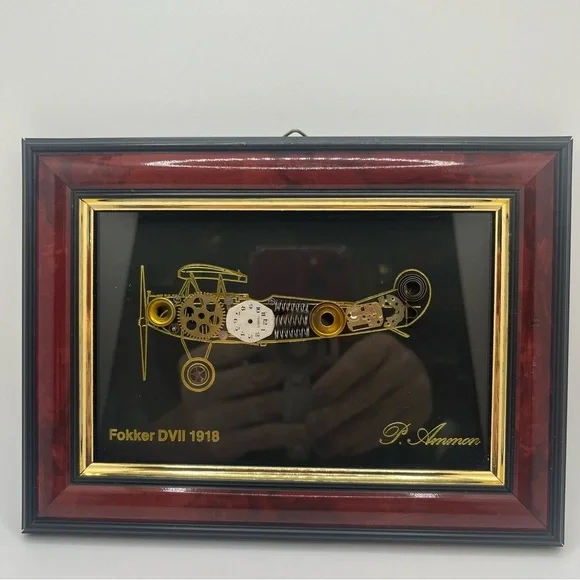 framed piece of art featuring a representation of an airplane with clock pieces - Picture 2 of 10